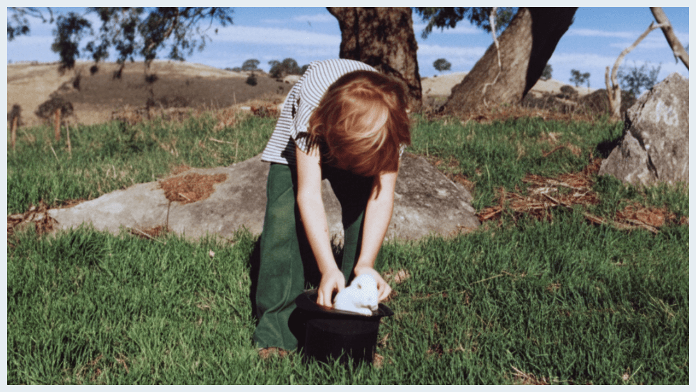 Martin reaching into a hat