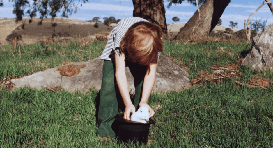 Martin reaching into hat